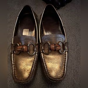 Gold Gucci loafers